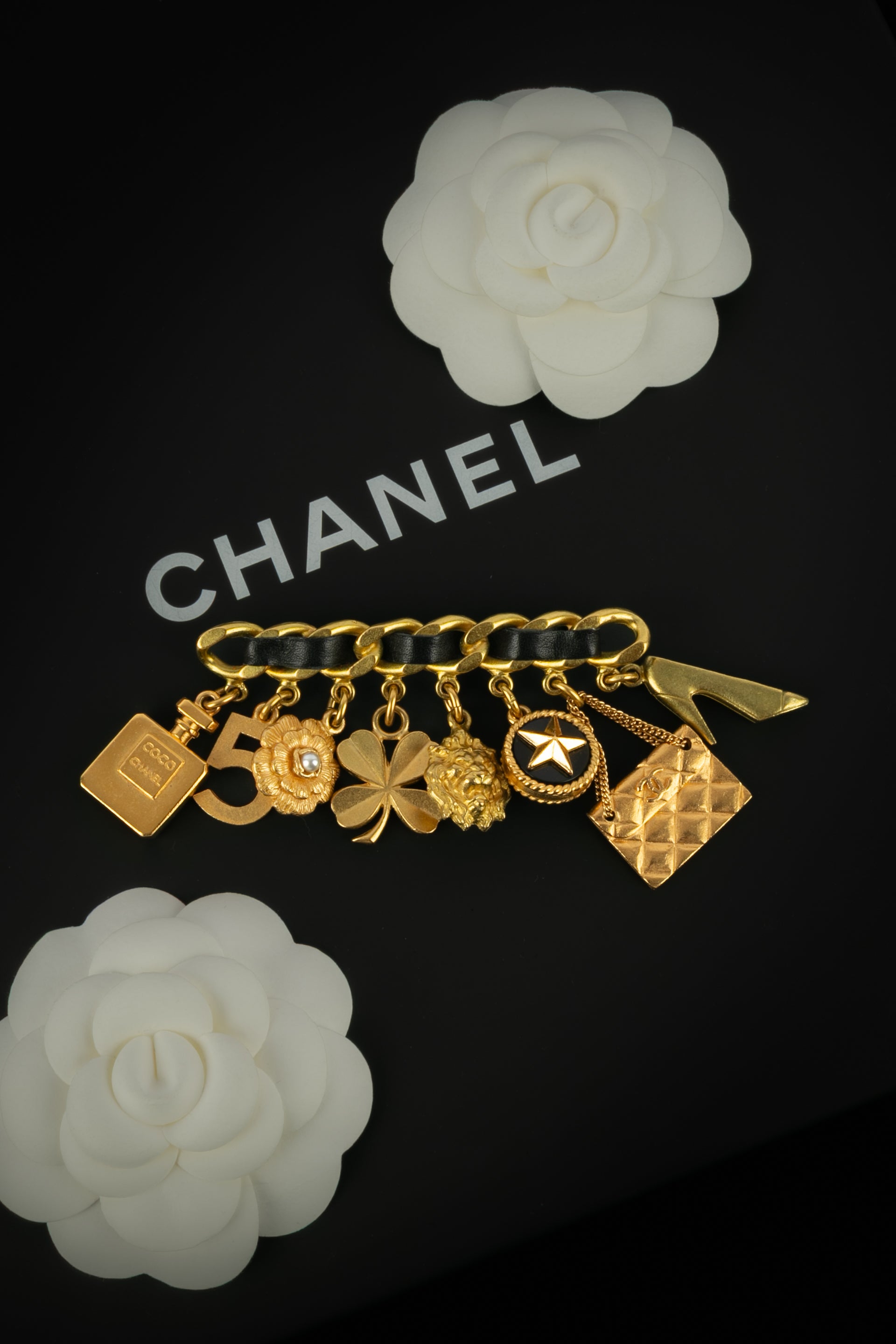 Broche breloques Chanel été 1995