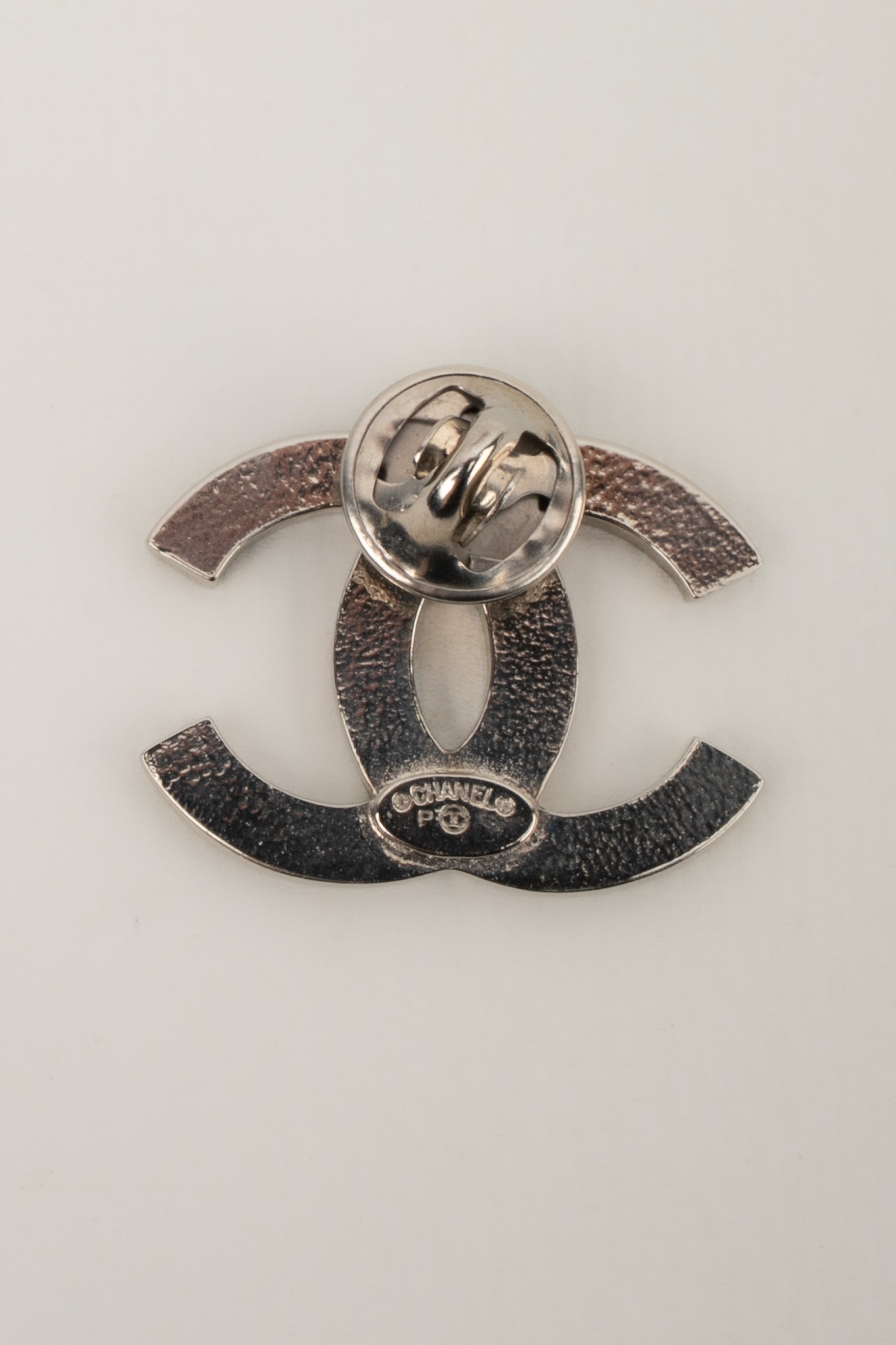 Chanel cc pin label by Karl Lagerfeld circa 2015 – Les Merveilles