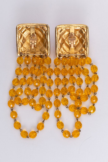 Boucles d'oreilles dorées Rochas