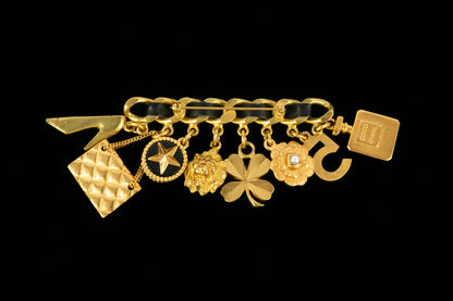 Broche breloques Chanel été 1995