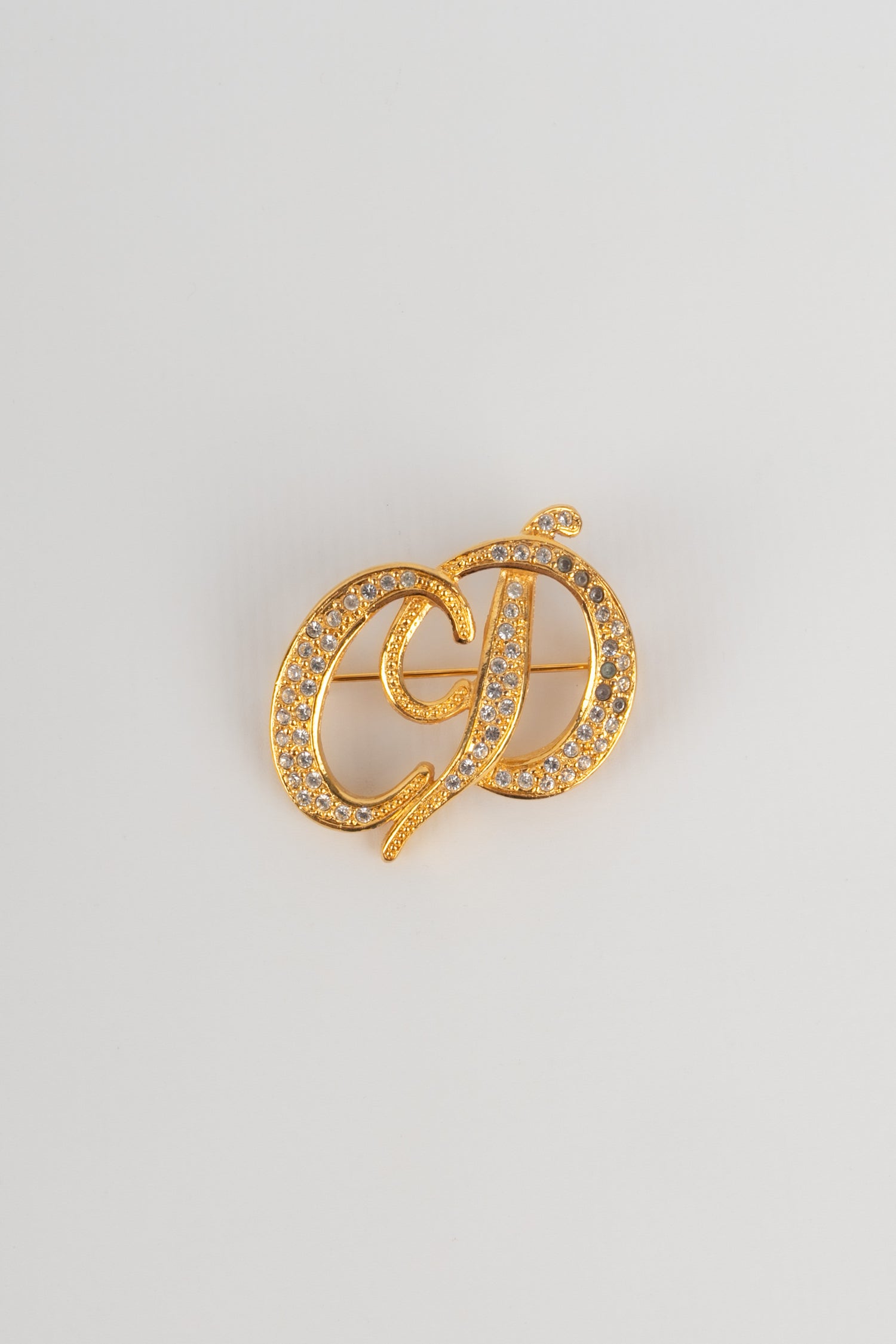 Broche dorée Christian Dior