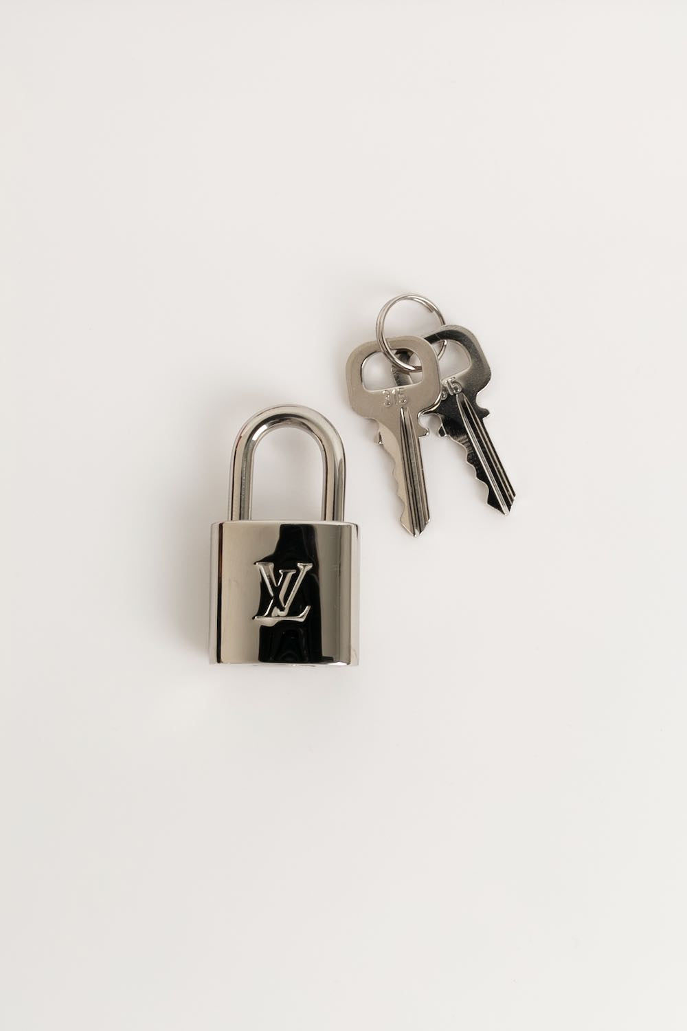Louis Vuitton padlock – Les Merveilles De Babellou