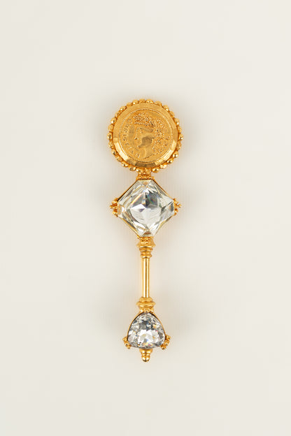 Broche dorée Dior