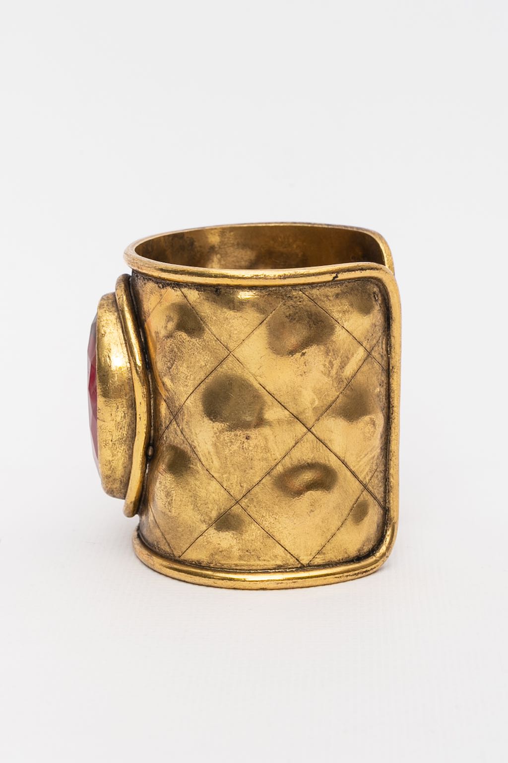Chanel gilded metal cuff bracelet with ruby rhinestone