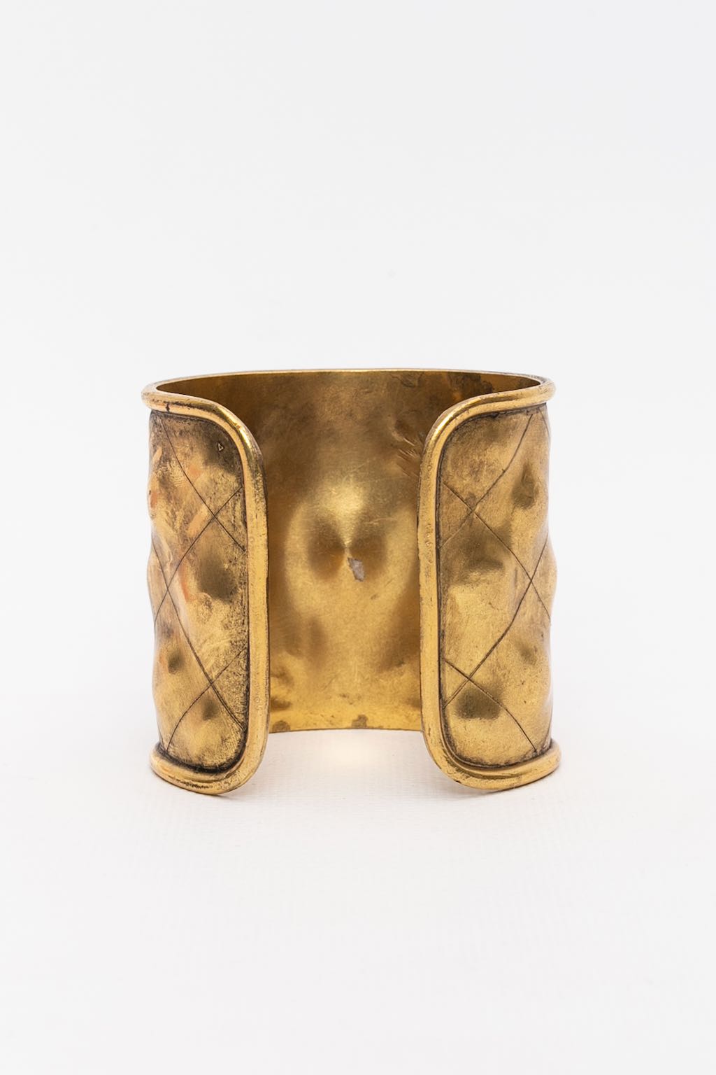 Chanel gilded metal cuff bracelet with ruby rhinestone