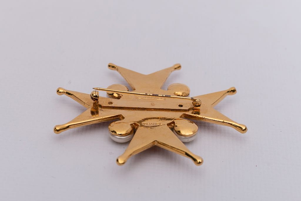 Chanel cross-shaped brooch