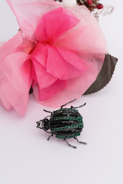 Broche scarabéé en pâte de verre