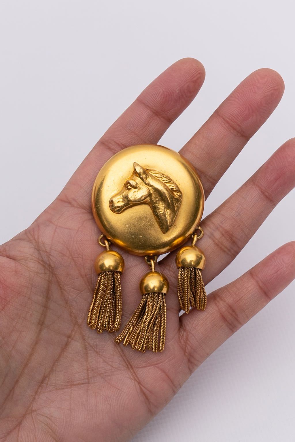 Broche "cheval" en métal doré